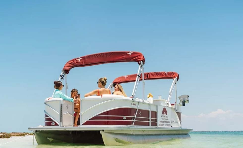 Pontoon boat anchored at a Clearwater Beach sandbar