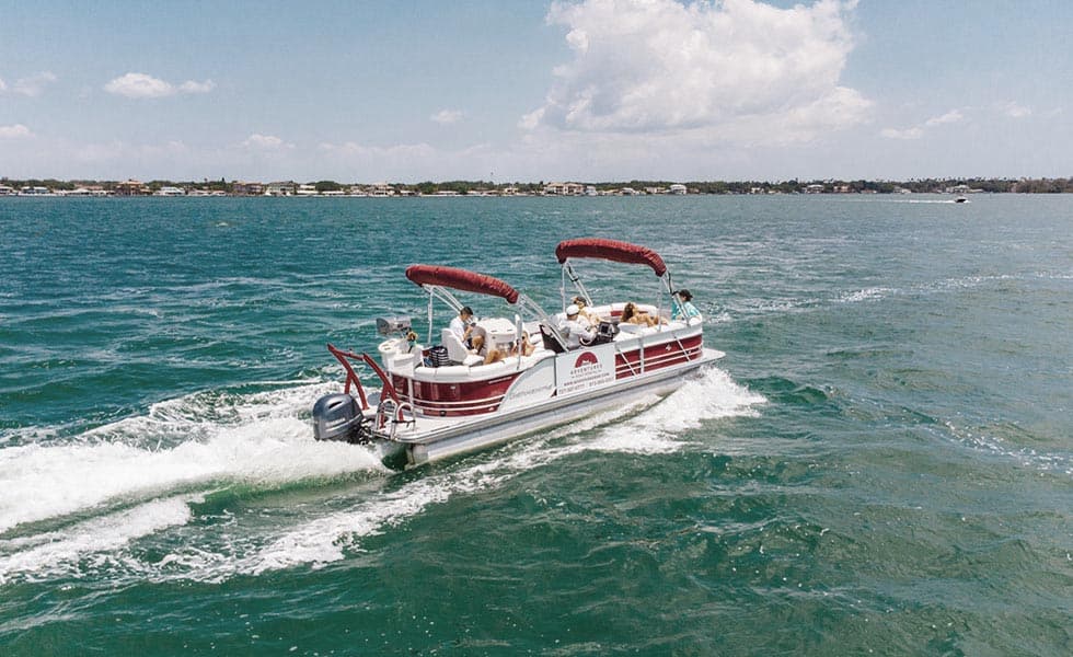 Pontoon boat cruising the Gulf off Clearwater Beach, Florida
